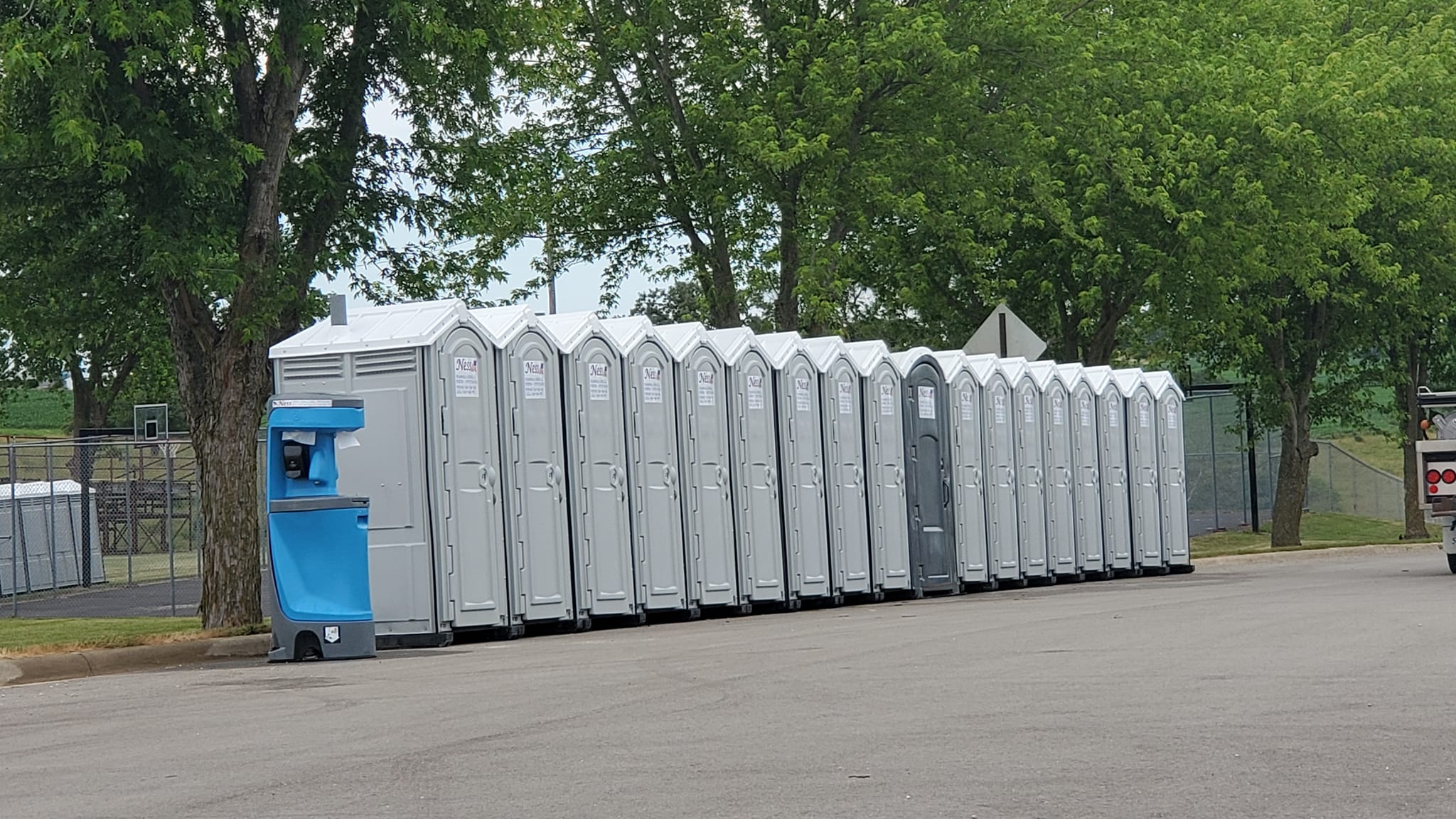 Clean porta potties lined up ready for delivery